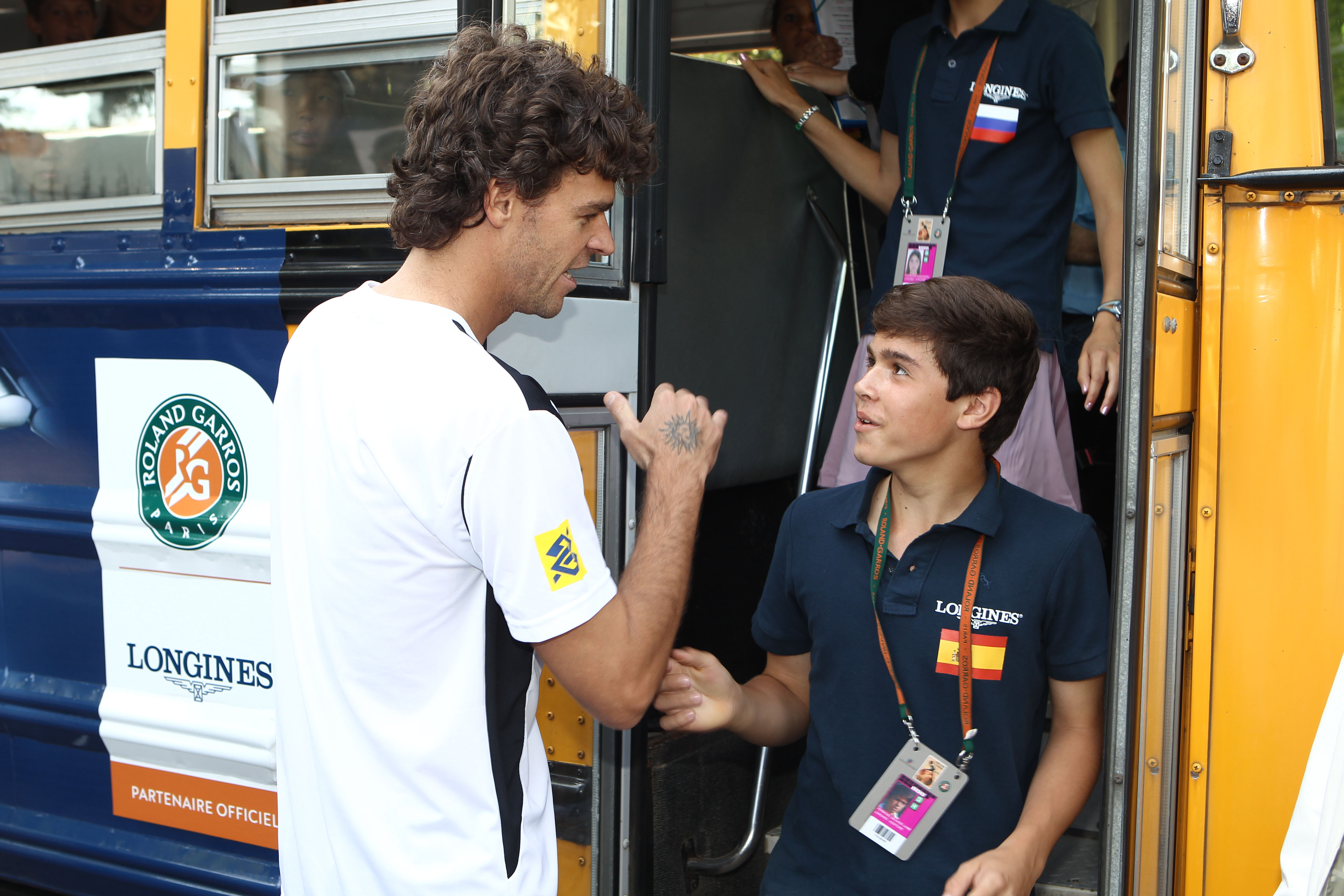 Jaime, 12, with Gustavo Kuerten at Roland Garros 2010